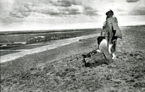 Two Selknam women looking at the Atlantic coast